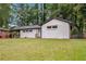 White brick ranch house with a large yard and mature trees at 2991 Catalina Dr, Decatur, GA 30032