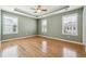 Spacious bedroom with hardwood floors and multiple windows at 6003 Turfway Park Ct, Sugar Hill, GA 30518