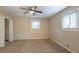 Spacious bedroom with ceiling fan, closet, and window at 4323 Autumn Hill Dr, Stone Mountain, GA 30083