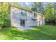 Back exterior view, showcasing a two-story house with a backyard at 4323 Autumn Hill Dr, Stone Mountain, GA 30083