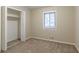 Cozy bedroom with mirrored closet doors and window at 4323 Autumn Hill Dr, Stone Mountain, GA 30083