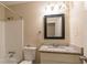 Clean bathroom with granite countertop, white vanity, and shower/tub combo at 4323 Autumn Hill Dr, Stone Mountain, GA 30083