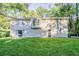 Back exterior view, showcasing a two-story house with a backyard at 4323 Autumn Hill Dr, Stone Mountain, GA 30083