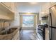 Kitchen with granite countertops, stainless steel appliances, and white cabinets at 4323 Autumn Hill Dr, Stone Mountain, GA 30083