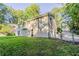 Side exterior view, showcasing a two-story house with a backyard at 4323 Autumn Hill Dr, Stone Mountain, GA 30083
