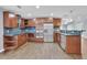 Modern kitchen with stainless steel appliances and dark wood cabinets at 3225 Fern Dr, Tucker, GA 30084