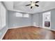 Large bedroom with hardwood floors and ceiling fan at 3225 Fern Dr, Tucker, GA 30084