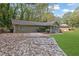 Ranch style home with a large yard and driveway at 3225 Fern Dr, Tucker, GA 30084