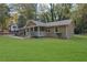 Single-story house with green lawn and covered porch at 3225 Fern Dr, Tucker, GA 30084