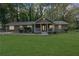 Front view of a charming house with a well-maintained lawn at 3225 Fern Dr, Tucker, GA 30084