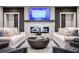 Elegant living room with a fireplace, comfortable seating, and large TV at 3351 Orwell Way # 2105, Cumming, GA 30041