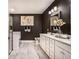 Modern bathroom with double vanity, dark walls, and tile floors at 3351 Orwell Way # 2105, Cumming, GA 30041