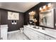 Modern bathroom with double vanity, dark walls, and tile floors at 3351 Orwell Way # 2105, Cumming, GA 30041
