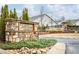 Community entrance with a stone sign, landscaping, and a welcoming atmosphere at 3351 Orwell Way # 2105, Cumming, GA 30041