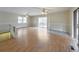 Living room features hardwood floors and access to a deck at 220 Winding Stream Trl, Hampton, GA 30228