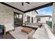 Covered patio perfect for outdoor entertaining with comfortable seating at 2635 Camp Branch Rd, Buford, GA 30519