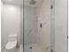 Large walk-in shower with marble tile and a rain shower head at 2635 Camp Branch Rd, Buford, GA 30519