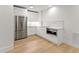 Modern white kitchen with stainless steel appliances in the basement at 2635 Camp Branch Rd, Buford, GA 30519