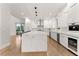 Open concept kitchen with large island and white cabinetry at 2635 Camp Branch Rd, Buford, GA 30519