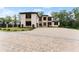 Elegant home with a paver driveway and manicured landscaping at 2635 Camp Branch Rd, Buford, GA 30519