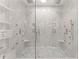 Large walk-in shower with multiple shower heads and built-in shelving at 2635 Camp Branch Rd, Buford, GA 30519