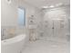 Spa-like bathroom featuring a freestanding tub and a large shower at 2635 Camp Branch Rd, Buford, GA 30519