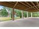 Covered patio with view of backyard and playset at 2635 Camp Branch Rd, Buford, GA 30519