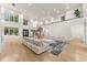Spacious living room with high ceilings, hardwood floors, and a modern aesthetic at 2635 Camp Branch Rd, Buford, GA 30519