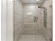Modern shower with grey tile and a rainfall shower head at 2635 Camp Branch Rd, Buford, GA 30519