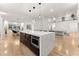 Spacious kitchen with modern island, stainless steel appliances, and hardwood floors at 2635 Camp Branch Rd, Buford, GA 30519