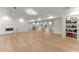Large, open basement space with hardwood floors and a pantry at 2635 Camp Branch Rd, Buford, GA 30519