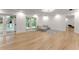 Finished basement recreation room with hardwood floors and access to backyard at 2635 Camp Branch Rd, Buford, GA 30519