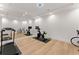 Home gym in the basement with mirror walls and cardio equipment at 2635 Camp Branch Rd, Buford, GA 30519