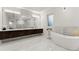 Elegant bathroom with double vanity, soaking tub, and walk-in shower at 2635 Camp Branch Rd, Buford, GA 30519
