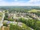 Aerial view of a luxury home community with spacious houses and lush green landscaping at 2635 Camp Branch Rd, Buford, GA 30519