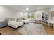 Spacious bedroom with two twin beds, built-in shelving, and a workspace at 2635 Camp Branch Rd, Buford, GA 30519