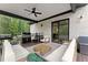 Spacious deck with built-in seating, a grill, and a beautiful wooded view at 2635 Camp Branch Rd, Buford, GA 30519