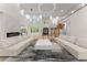 Open living area with high ceilings, modern fireplace, and hardwood floors at 2635 Camp Branch Rd, Buford, GA 30519