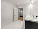 Modern basement bathroom with double vanity and marble flooring at 2635 Camp Branch Rd, Buford, GA 30519