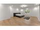 Spacious bedroom with hardwood floors and a large window at 2635 Camp Branch Rd, Buford, GA 30519
