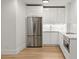 Modern white kitchen with stainless steel appliances in the basement at 2635 Camp Branch Rd, Buford, GA 30519