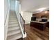 Carpeted stairs with metal railing leading to the second floor at 1827 Old Dogwood, Jonesboro, GA 30238