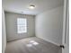 Bright bedroom with carpet and a large window at 1827 Old Dogwood, Jonesboro, GA 30238