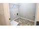 Laundry room with tile floor and built-in shelving at 1827 Old Dogwood, Jonesboro, GA 30238