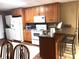 Basement kitchen with wood cabinets and a breakfast bar at 180 Maddox Rd, Buford, GA 30518