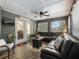 Relaxing sunroom features comfortable seating, ample natural light, and a ceiling fan at 180 Maddox Rd, Buford, GA 30518