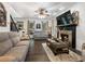 Spacious living room features a fireplace and hardwood floors at 180 Maddox Rd, Buford, GA 30518