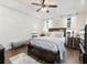 Spacious main bedroom with hardwood floors and ceiling fan at 180 Maddox Rd, Buford, GA 30518