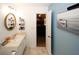 Bright bathroom with vanity, mirror, and access to bedroom at 840 Brandy Oaks Ln, Stone Mountain, GA 30088