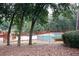 Community swimming pool with surrounding trees at 840 Brandy Oaks Ln, Stone Mountain, GA 30088